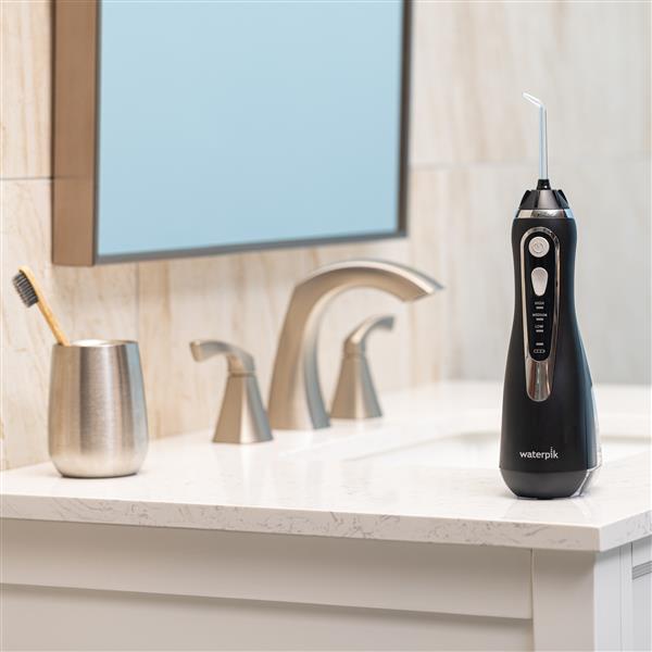black-cordless-advanced-water-flosser-wp-582-in-bathroom.jpg