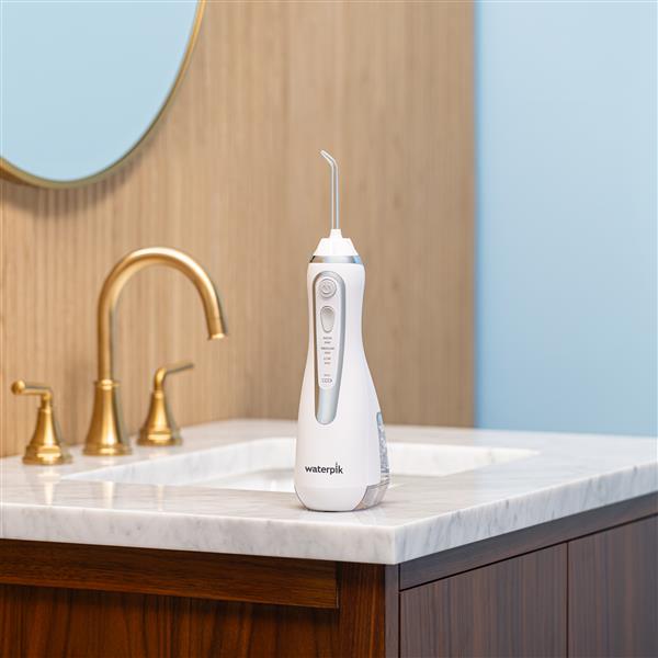 white-cordless-advanced-water-flosser-wp-580-in-bathroom.jpg